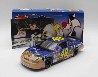 ** Comes w/Picture of Driver Autographing Diecast ** Jimmie Johnson Autographed 2002 Lowes / Looney Tunes Rematch 1:24 Nascar Diecast ** Comes w/Picture of Driver Autographing Diecast ** Jimmie Johnson Autographed 2002 Lowes / Looney Tunes Rematch 1:24 Nascar Diecast